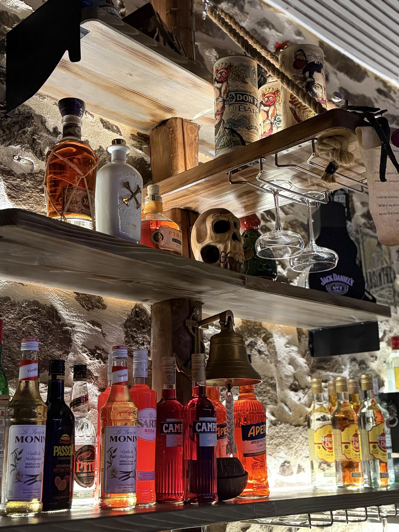 Pirate-themed shelf with a skull, dagger and parchment scroll